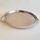 Round glass and art deco silver metal tray
