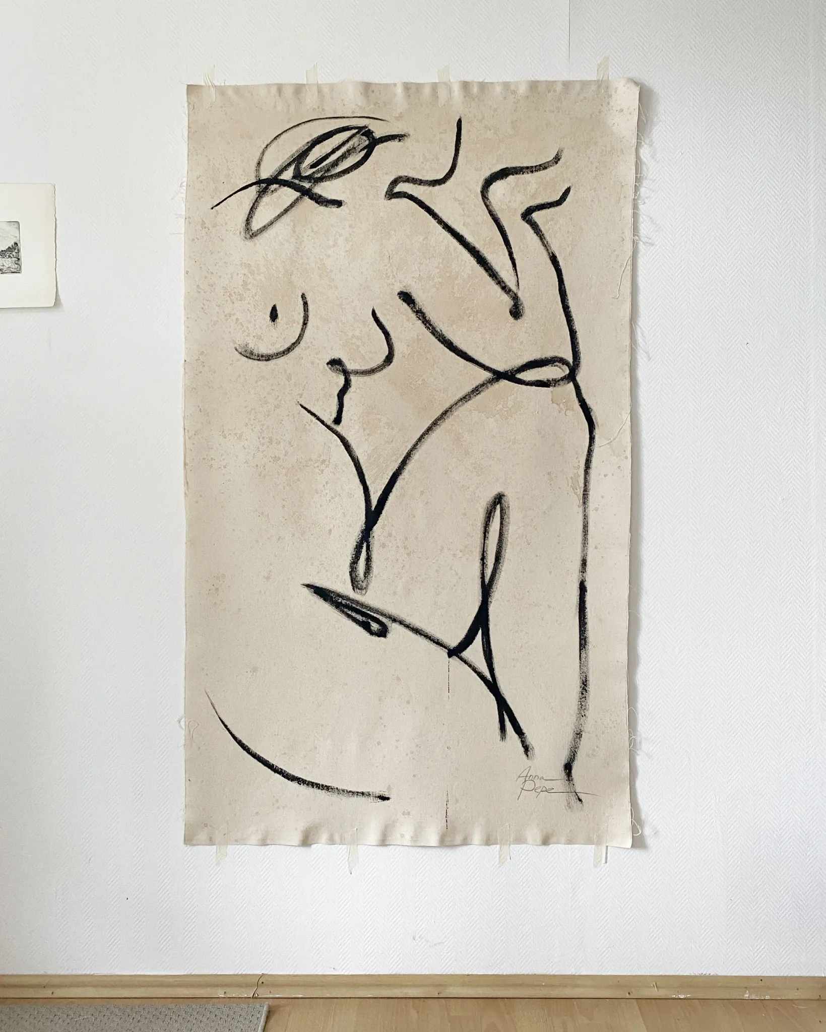 Female painting on unprimed canvas