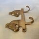 Wall-mounted coat rack with horses in brass