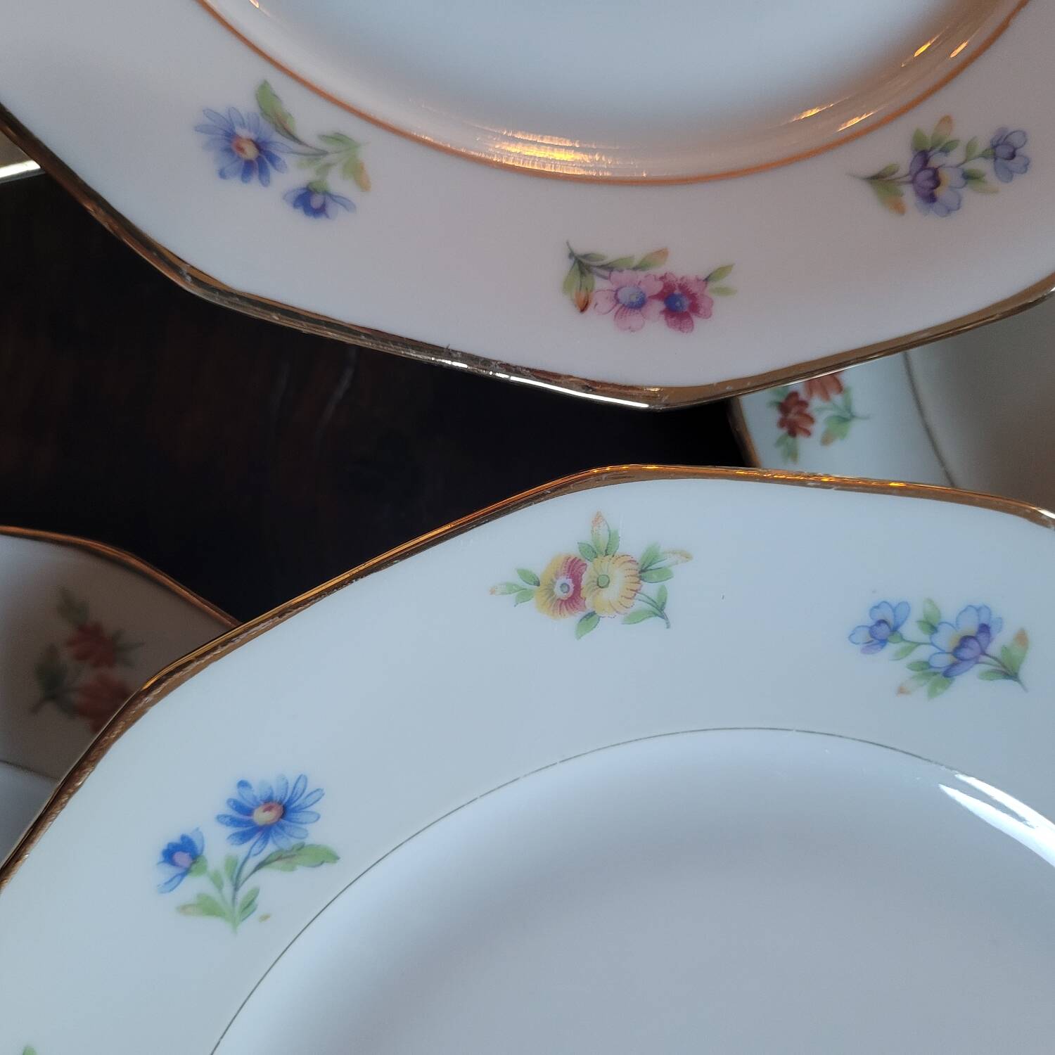 8 porcelain dessert plates with gold rim and various flowers