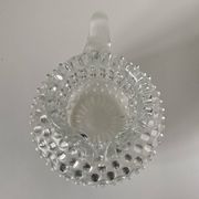 Beautiful and large vintage glass jug with a handle, made of clear hot-worked glass.