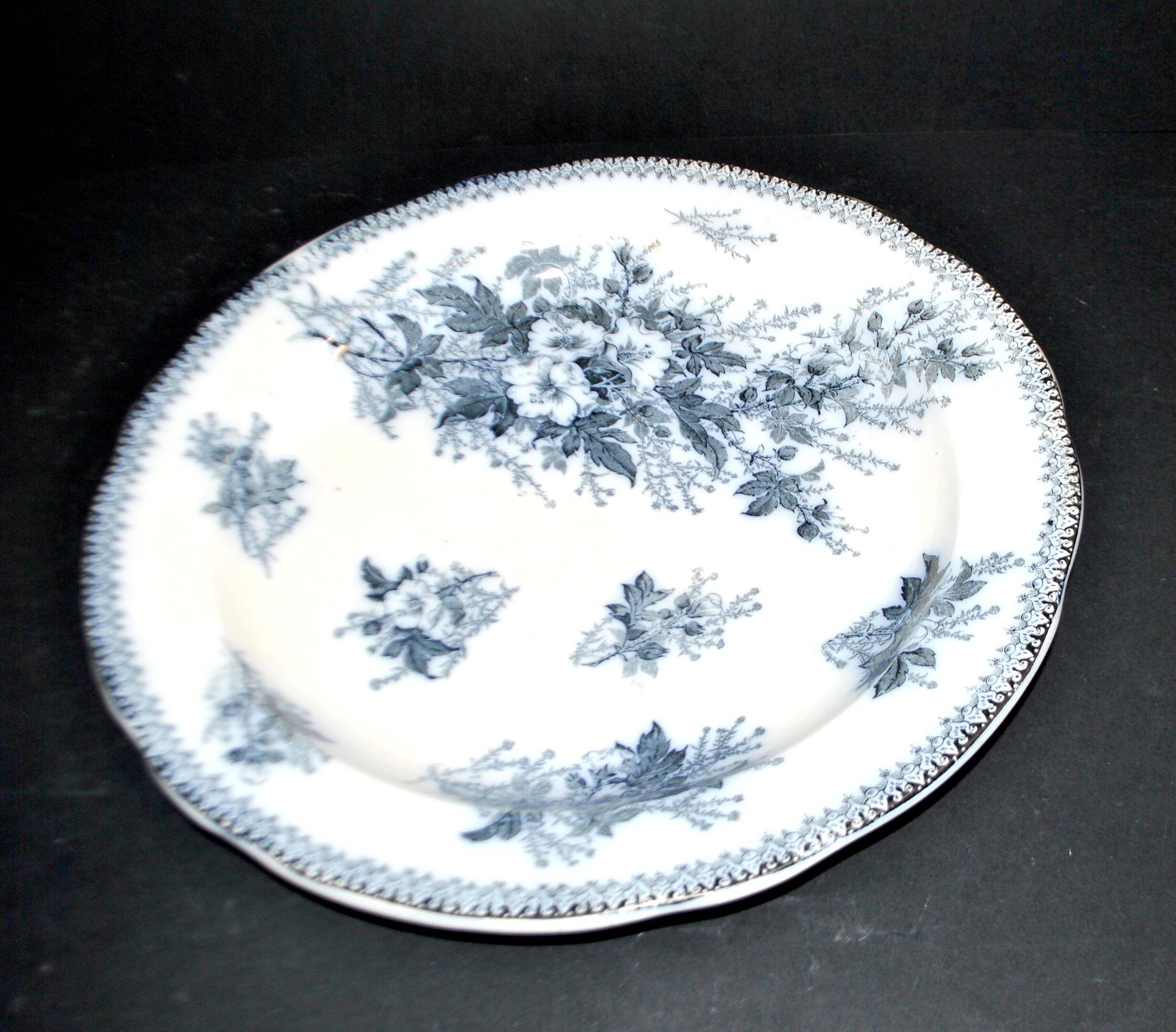 Large round antique plate with monochrome blue and black floral decoration, circa 1850.