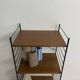 small vintage metal and teak string bookshelf