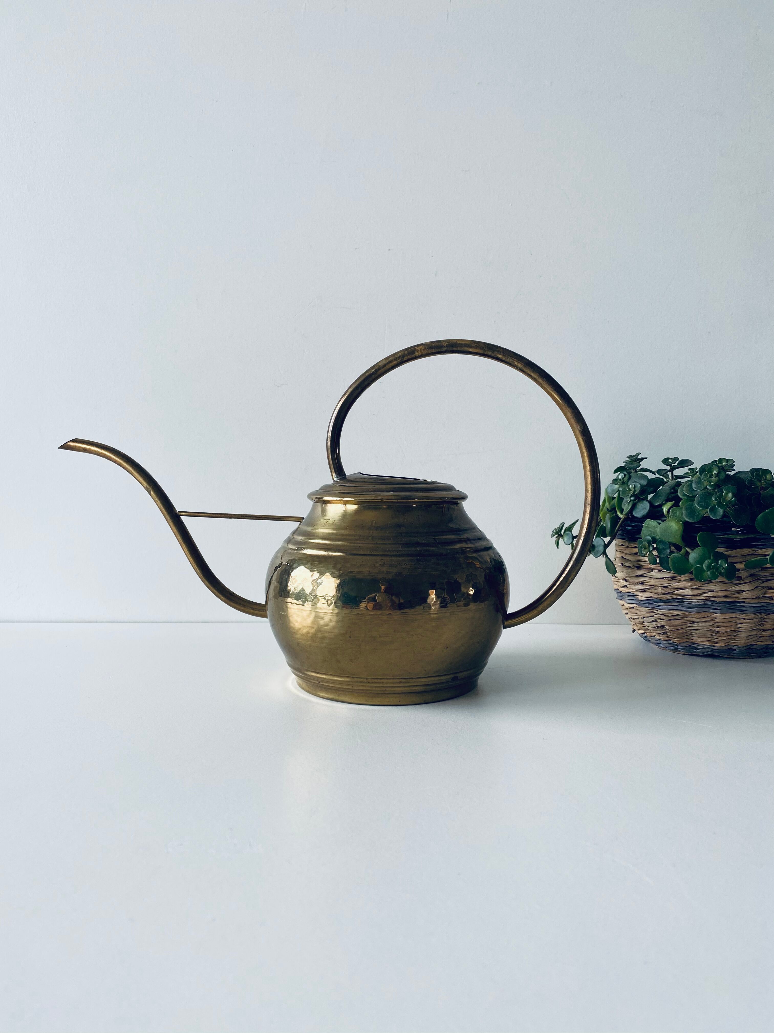 Old brass watering can