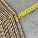 Large lampshade made of woven ropes.