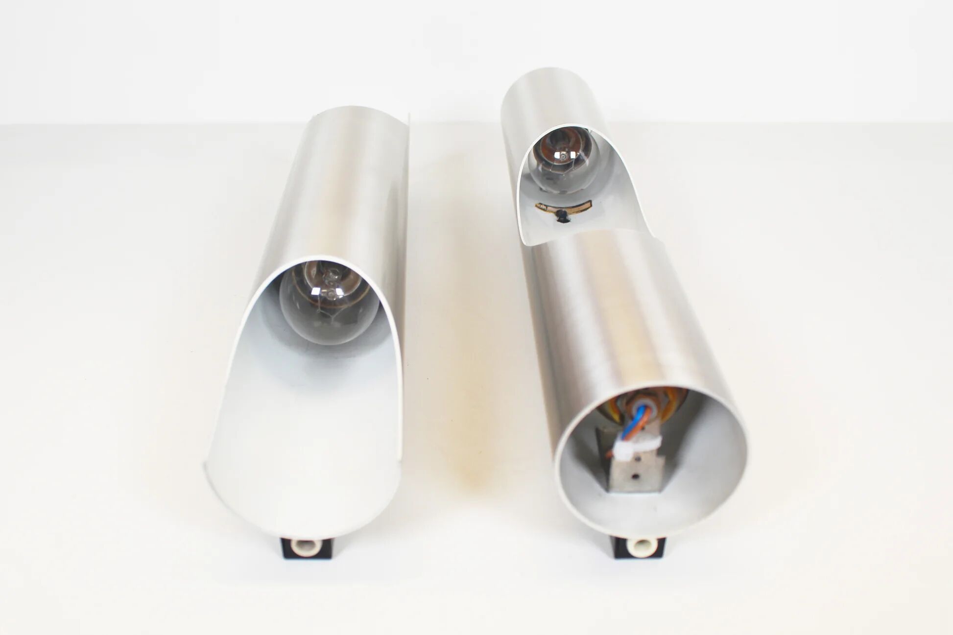 Pair of 70s 'fuga' wall lamps by raak