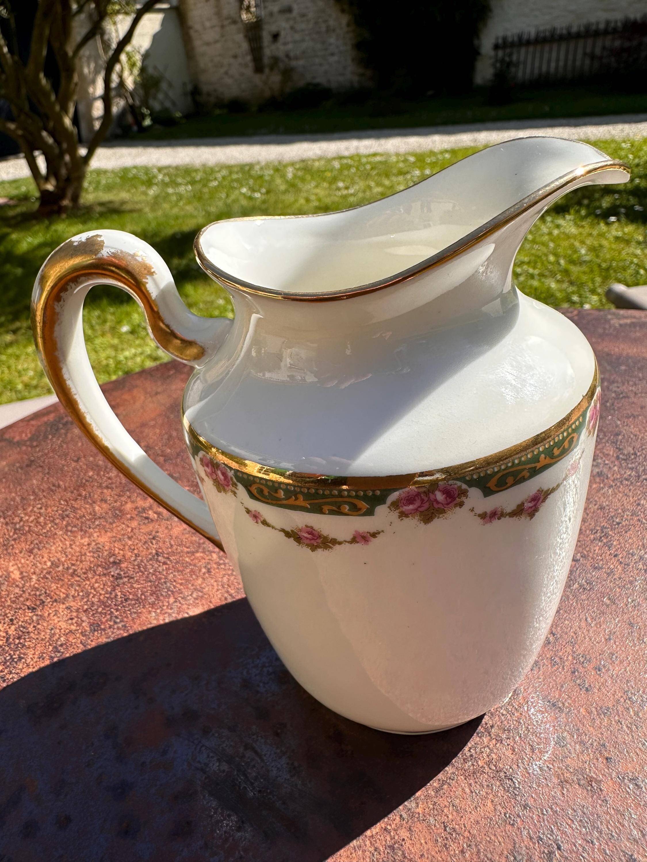 Set of jug, sugar bowl, and milk jug in Limoges porcelain by Paul Past.