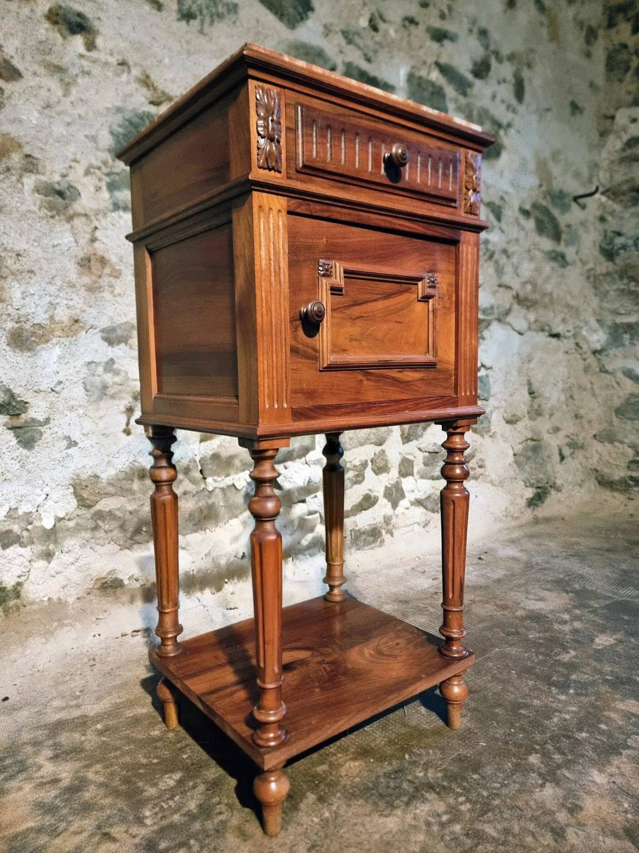 Antique French bedside table with a marble top.