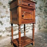 Antique French bedside table with a marble top.