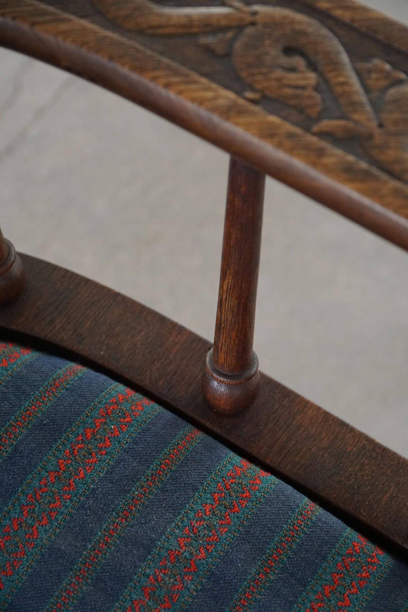 Scandinavian armchair in solid oak with cushion, folk art, early 19th century.