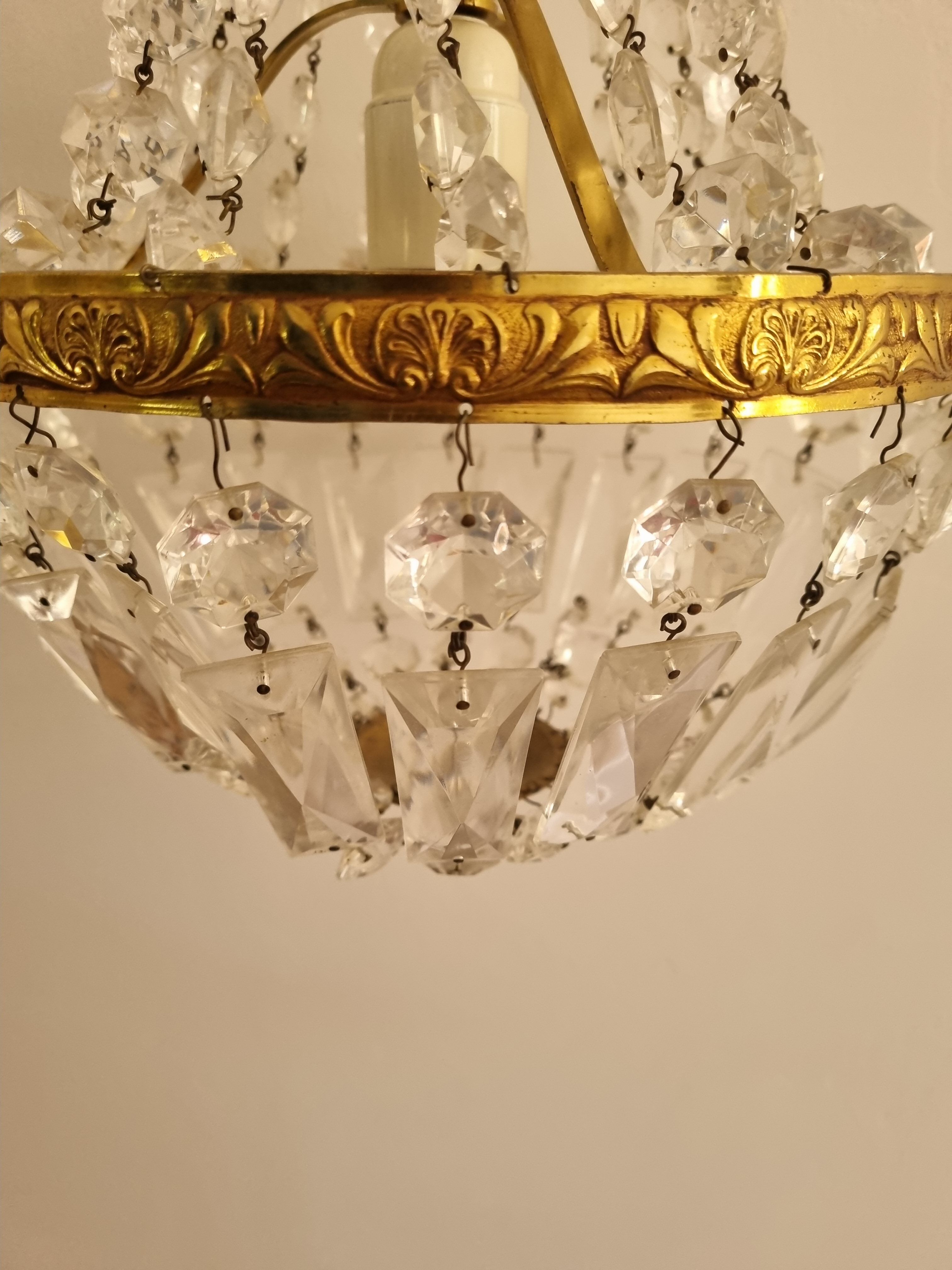Brass chandelier and grapevine glass