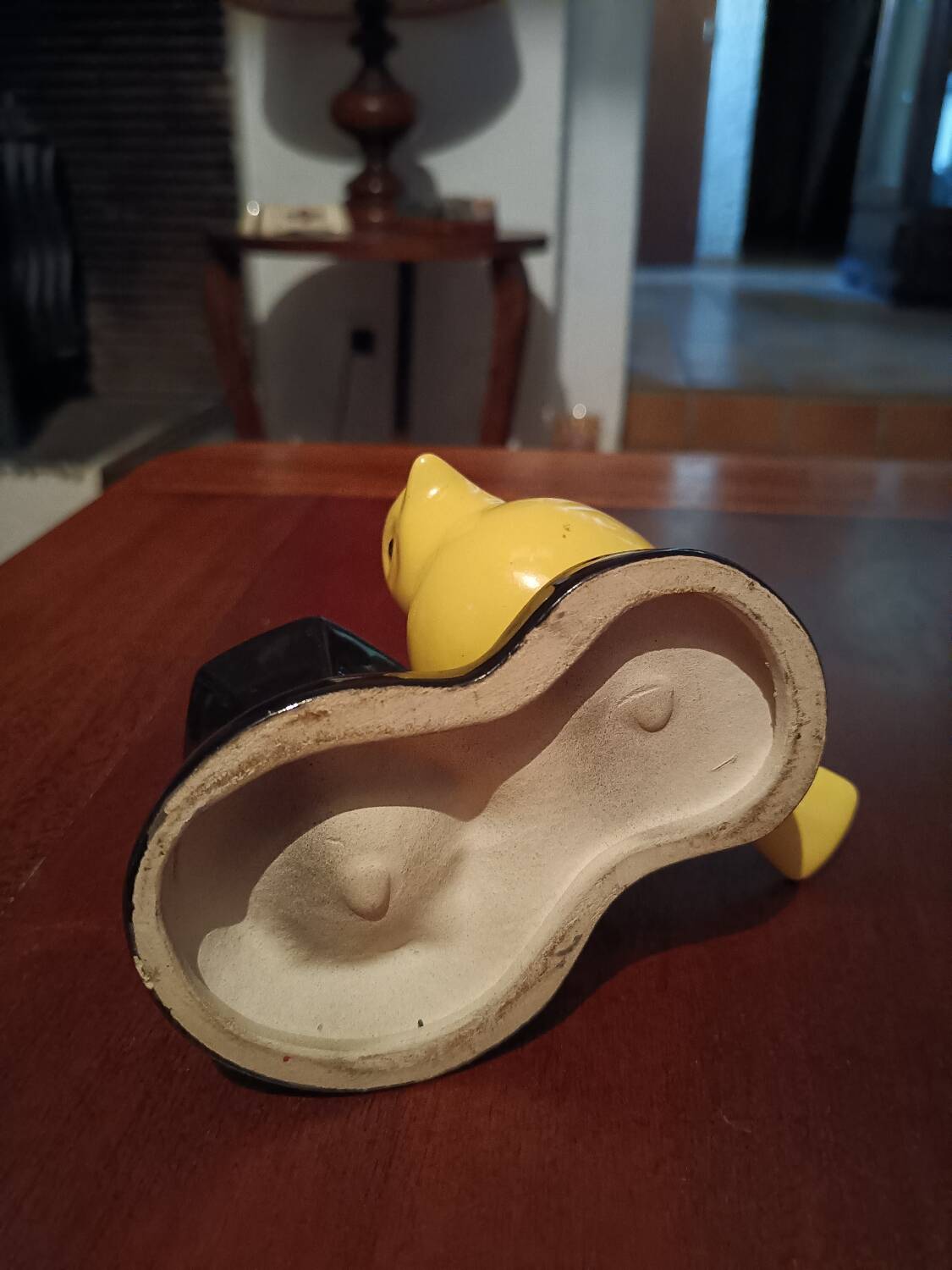 Yellow canary figurine and its candle holder