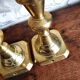 Duo of brass candle holders