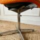 Chrome metal chair with orange fabric from the 70s.