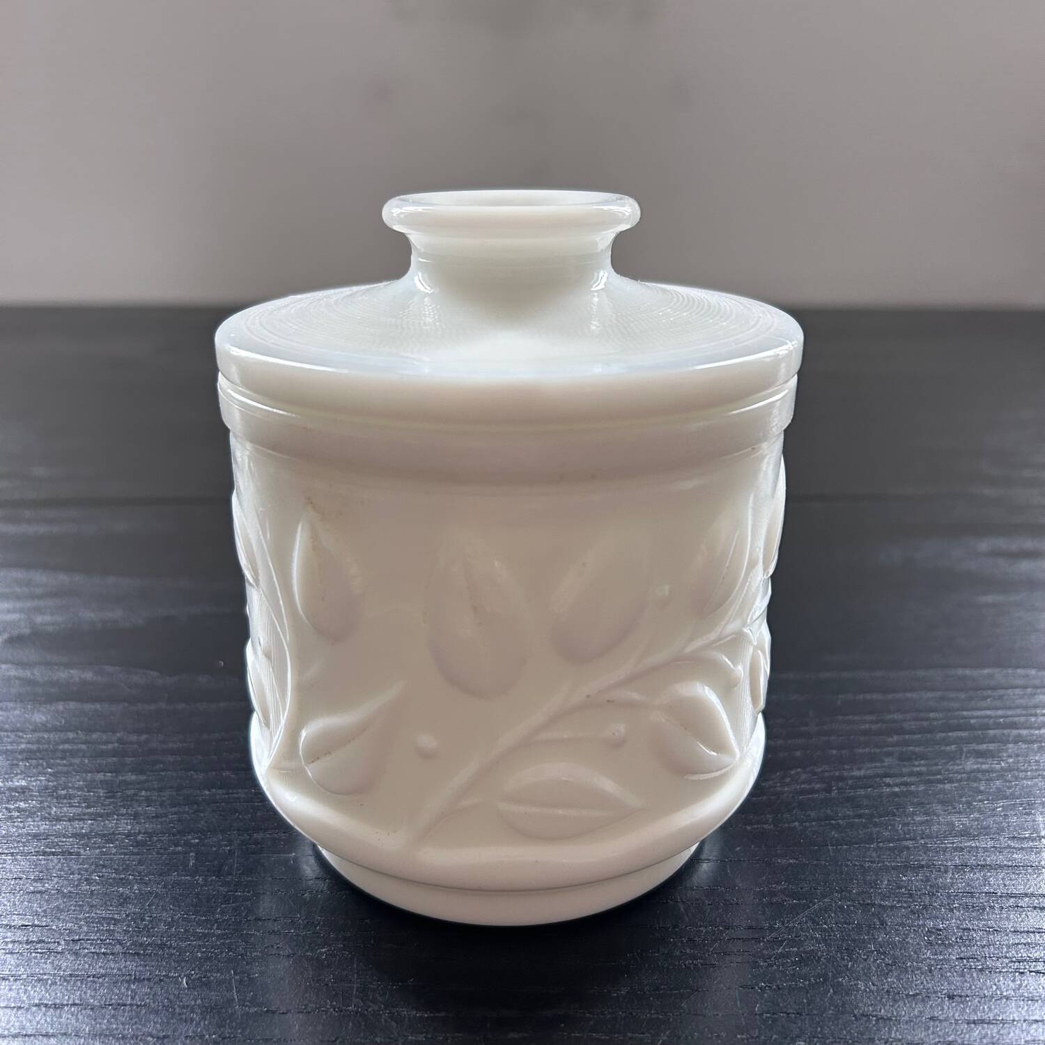 White pot with plant decoration