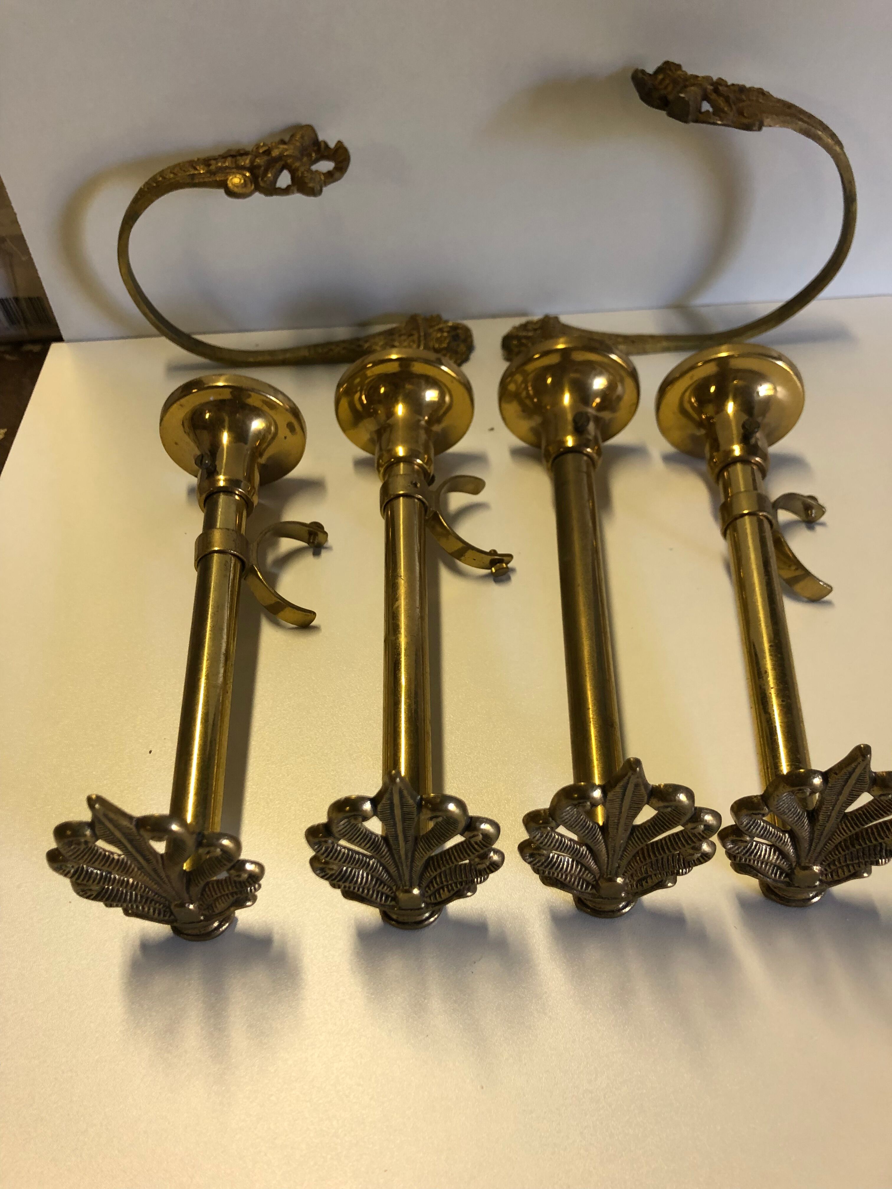 Supports curtain rods and ambers