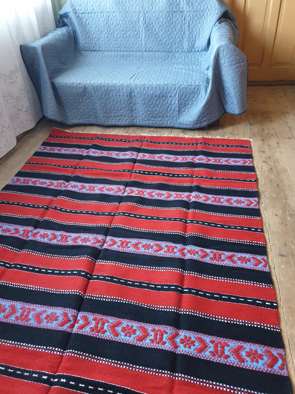 Traditional rustic red wool rug with stylized design and stripes, authentic hand-woven 160x230cm