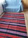Traditional rustic red wool rug with stylized design and stripes, authentic hand-woven 160x230cm