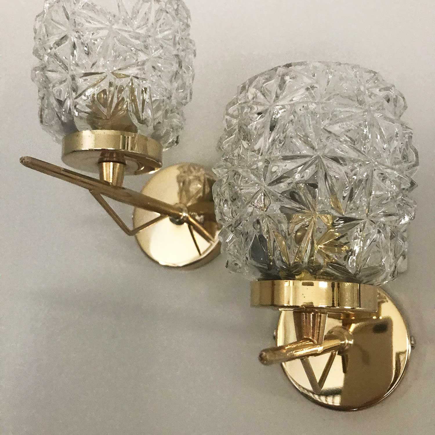 Pair of glass and brass wall lamps