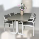 Dining table set and 4 dining chairs by Pierre Mennen for Pastoe.