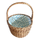 Wicker basket with waxed canvas blue flowers
