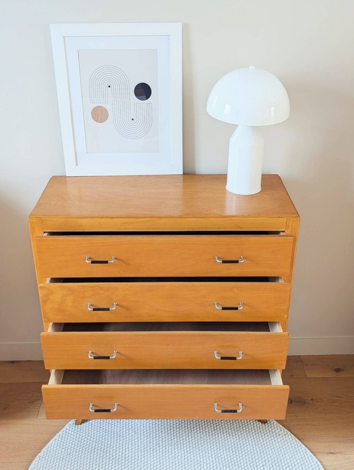 Vintage chest of drawers with tapered legs from the 1960s.