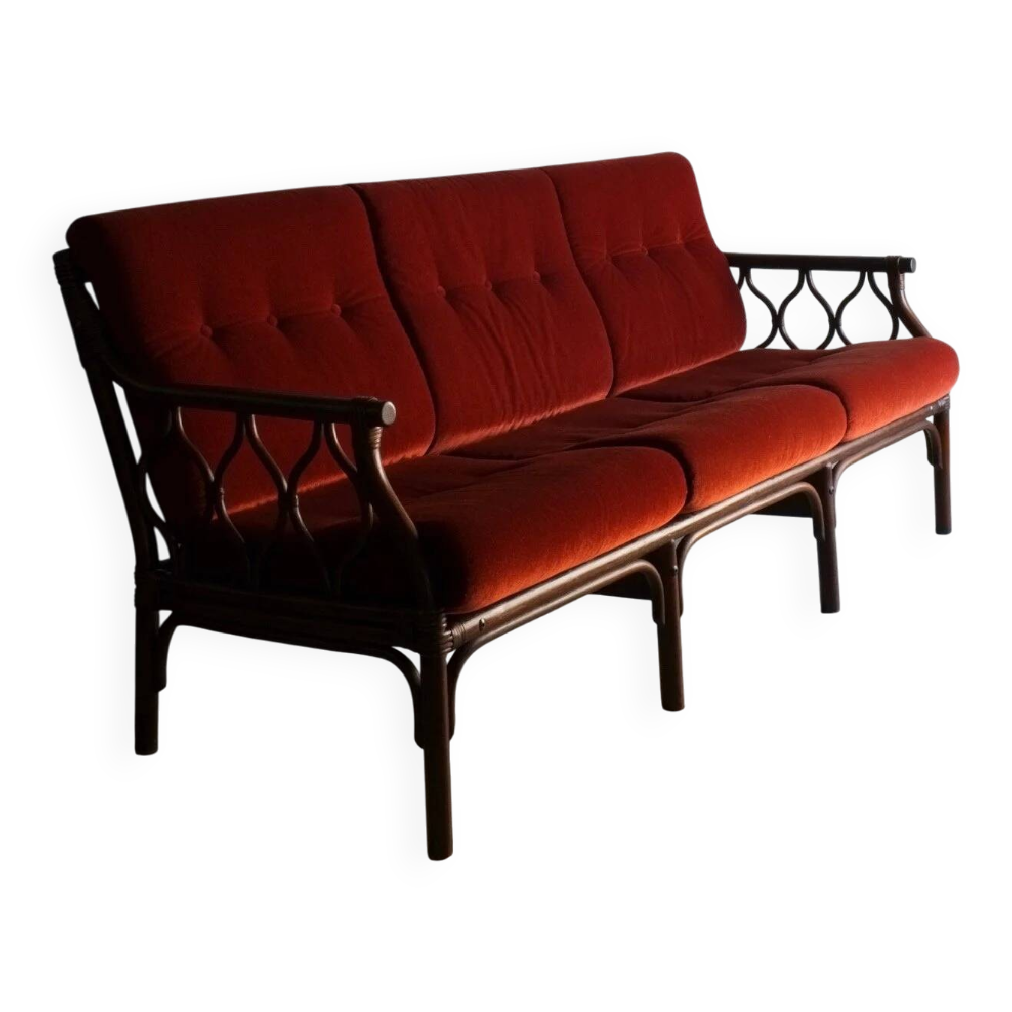 Dark rattan 3-seater sofa with red velour cushions | 1980s