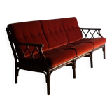 Dark rattan 3-seater sofa with red velour cushions | 1980s