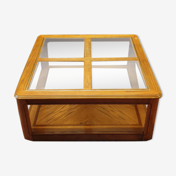 Wood and glass coffee table on wheels