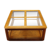 Wood and glass coffee table on wheels