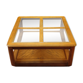 Wood and glass coffee table on wheels