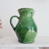 Antique green pitcher in painted terracotta