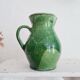 Antique green pitcher in painted terracotta
