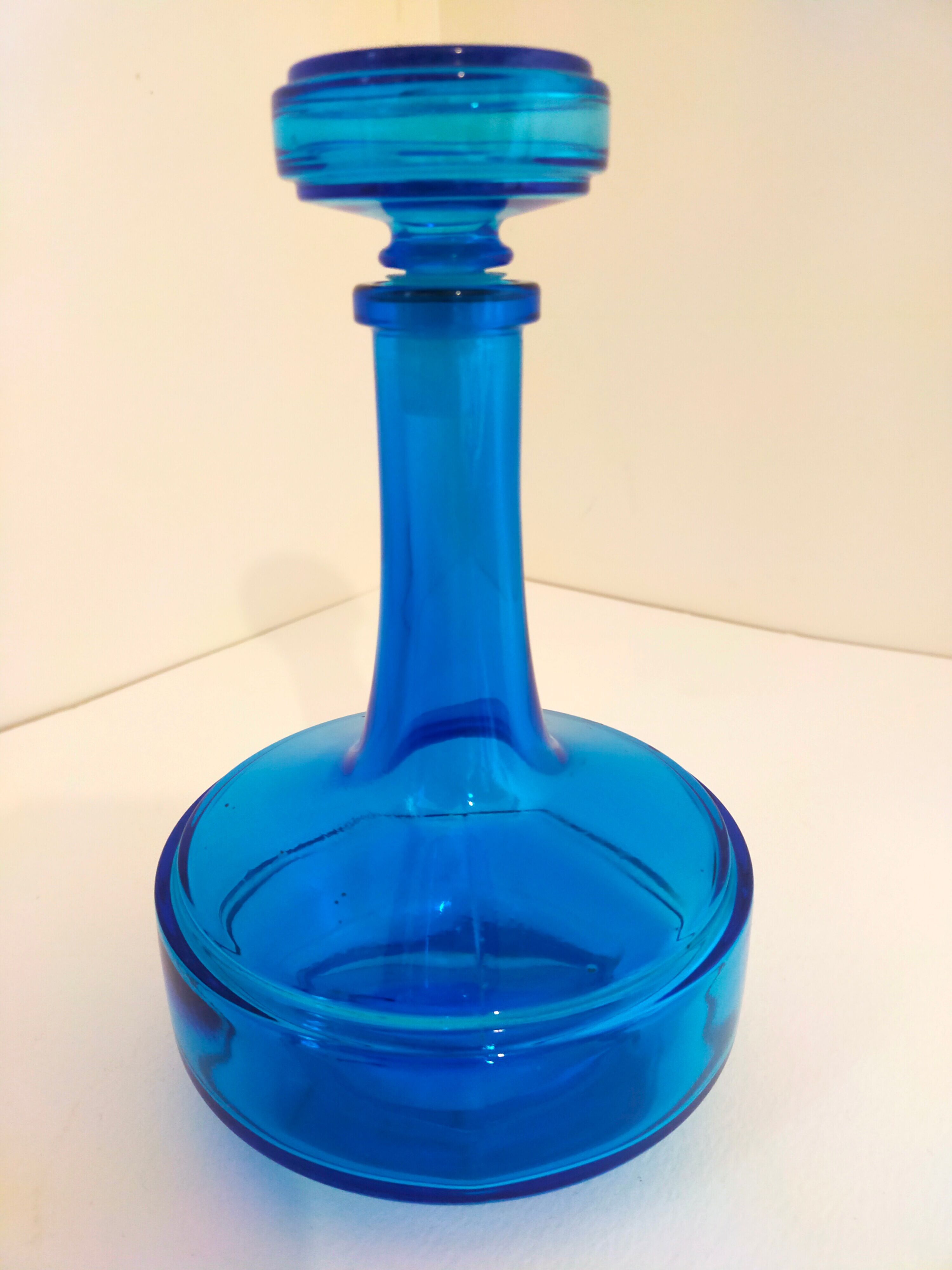 Bottle of old perfume of blue color