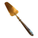 Silver cake shovel filled with silver metal