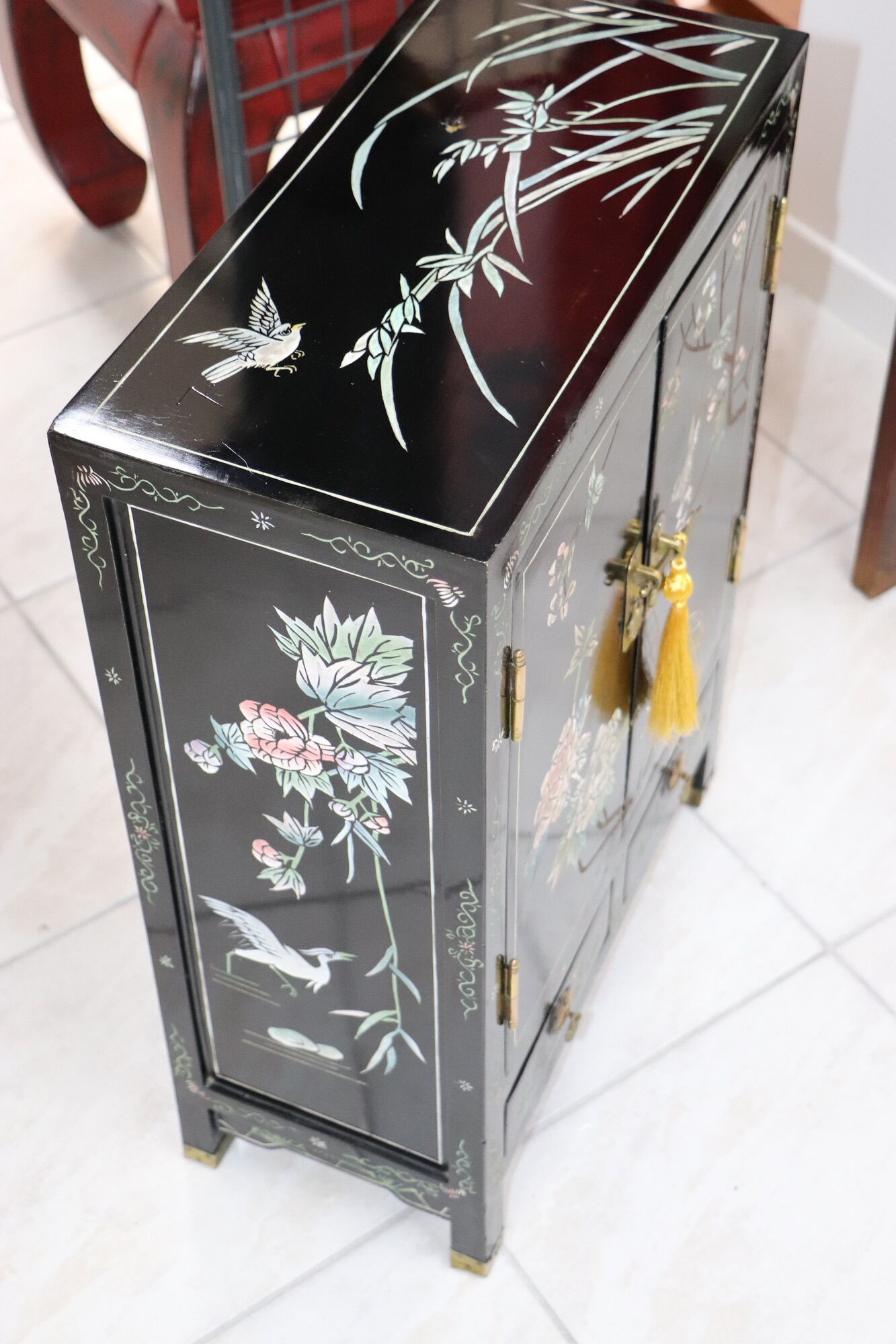 Small storage cabinet or bedside table lacquered black incised and painted