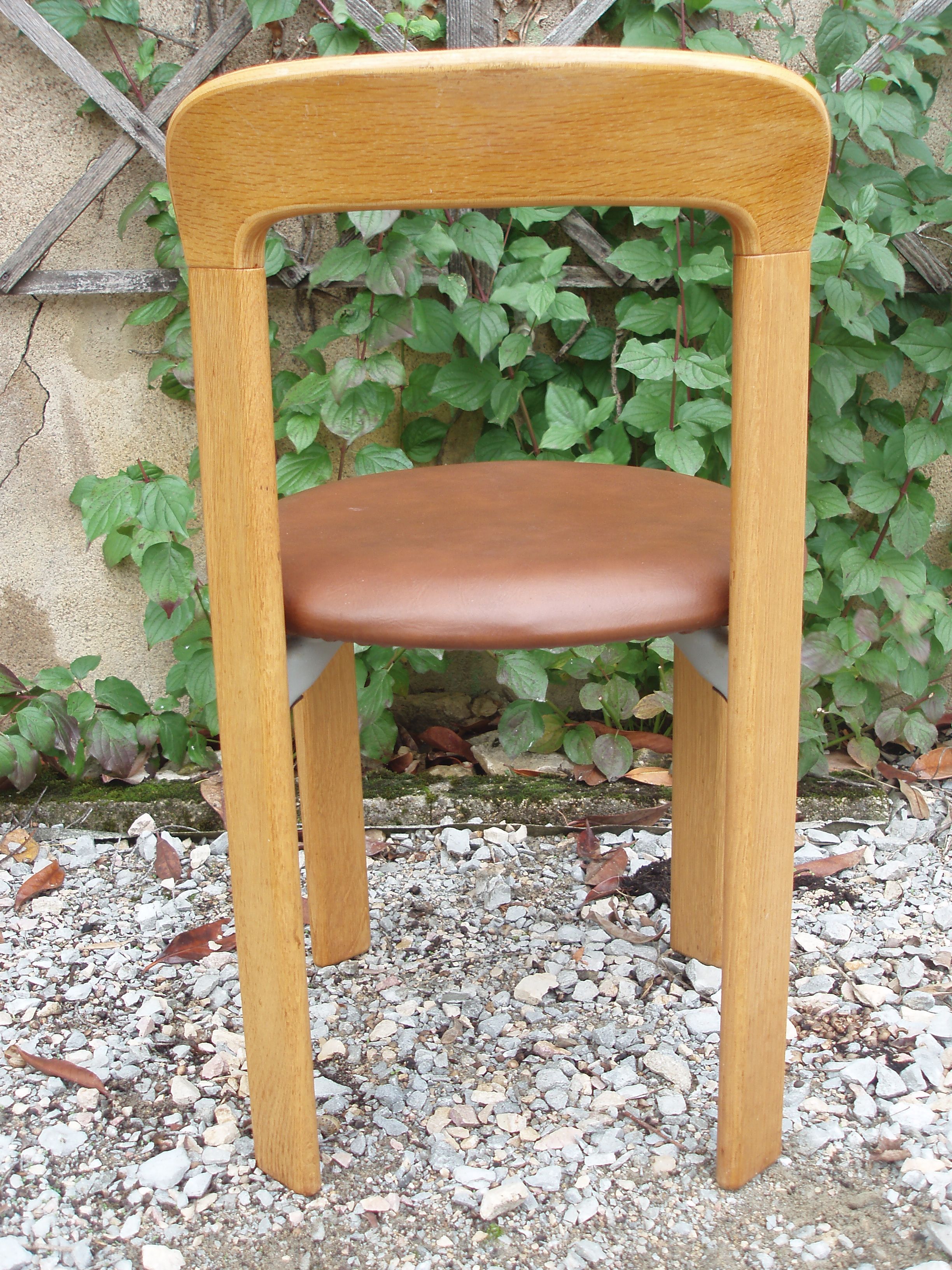 Pair of chairs by Swiss designer Bruno Rey in wood and brown skai