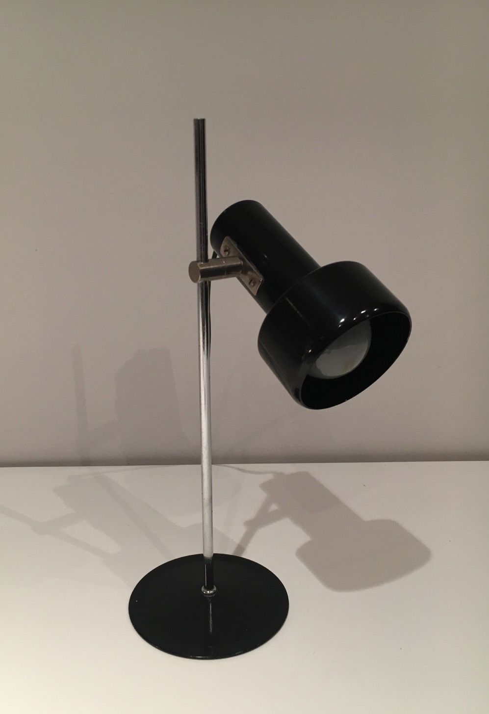 Adjustable lamp in black lacquered metal and chrome. French work. Circa 1970.