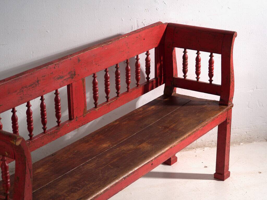 Old red-painted pine bench with turned backrest – Central Europe, circa 1900