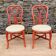 Pair of red rattan chairs and fabric