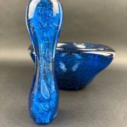 Mortar and pestle in the style of Biot, hard blue.