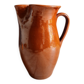 Orange-brown glazed terracotta pitcher — antique handmade pottery