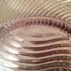 Twisted glass fruit cup of purplish pink color