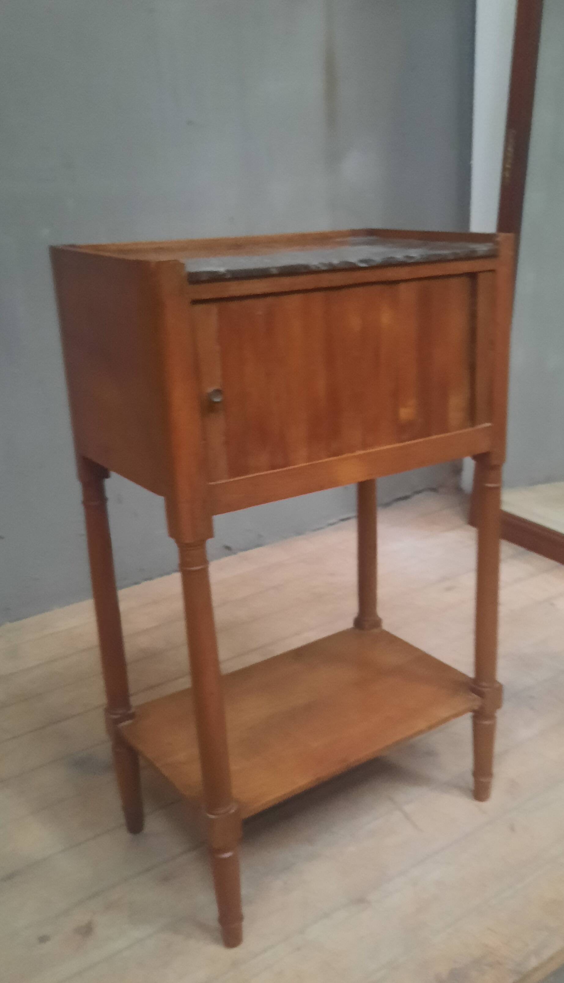 Curtained bedside table from the nineteenth century.