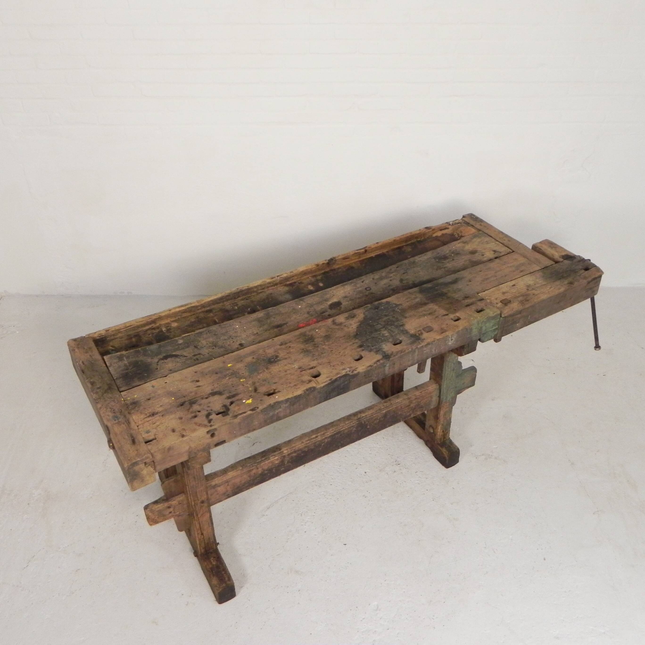 Wooden industrial workbench with vice, 194 cm long, 1930s.