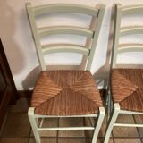 Pair of green straw chairs