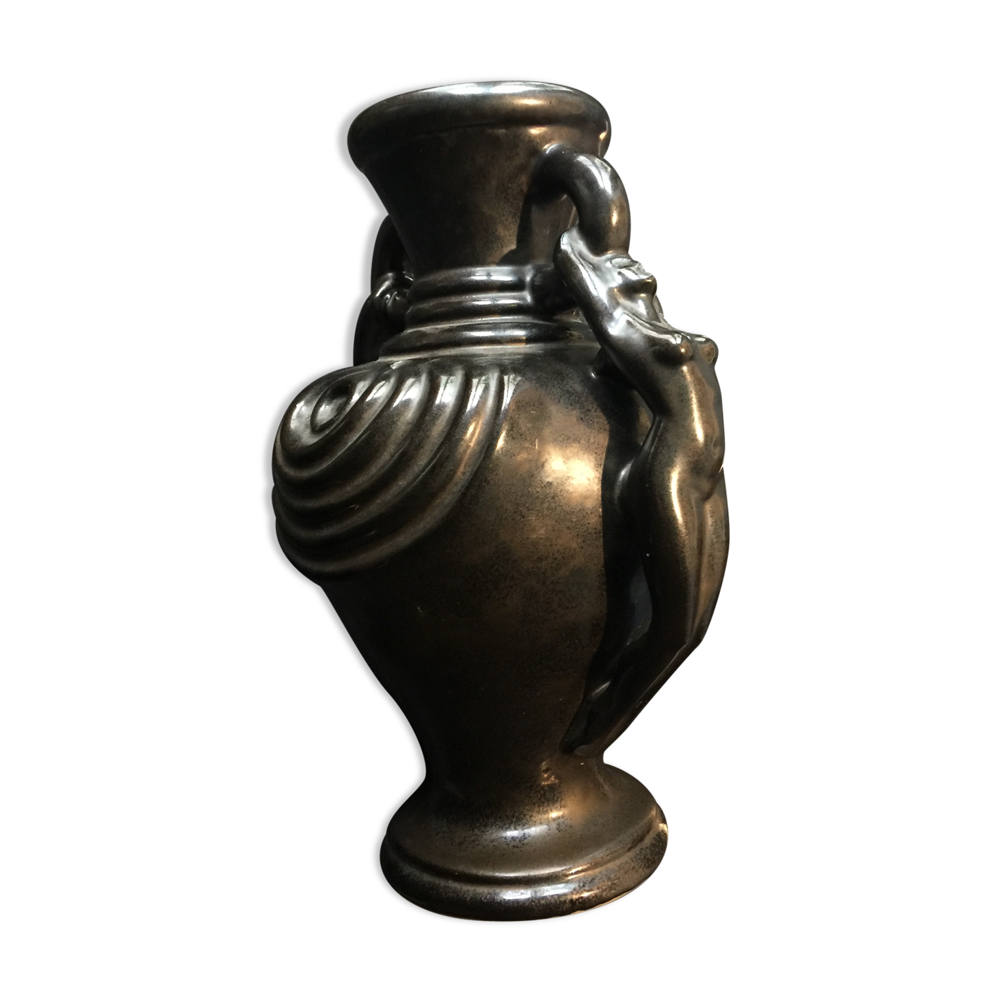 Black ceramic vase caught in naked women's bodies