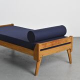 Wooden bench with midnight blue fabric, France, circa 1955