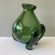 Amazing pitcher; vintage tripod jug or carafe in blown and hot-worked green glass