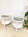 Pair of bohemian rattan bedside tables, circa 1970.
